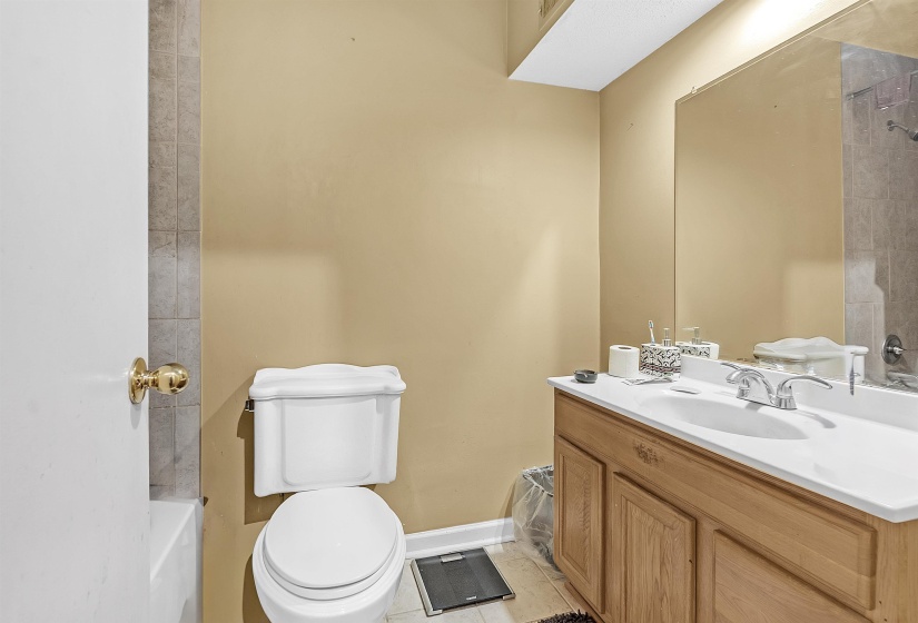Bathroom with vanity and light tile patterned flooring