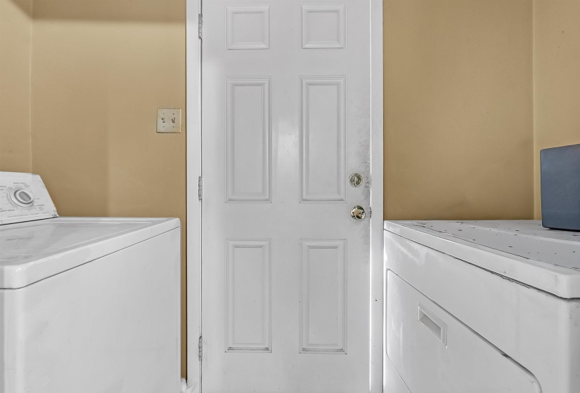 Laundry room with washer and clothes dryer