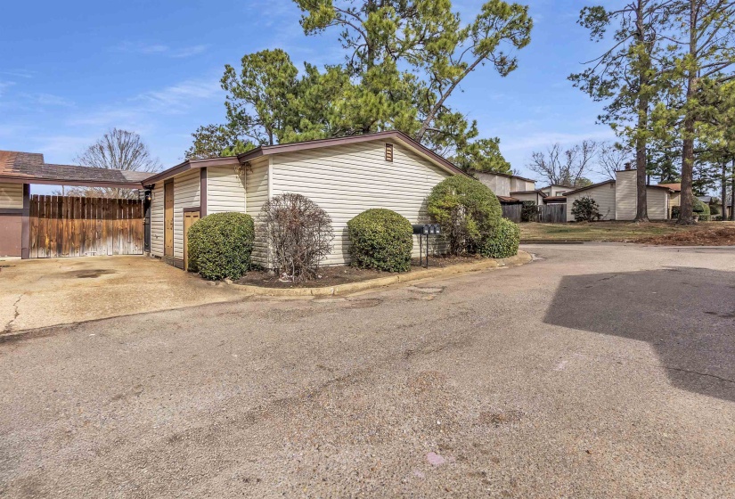 View of side of property featuring driveway