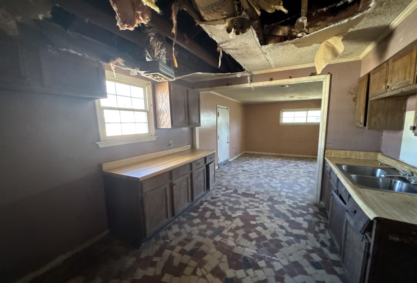Kitchen with light countertops and crown molding