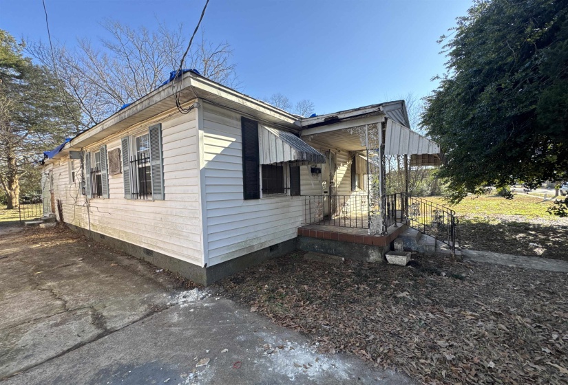 View of side of property with crawl space