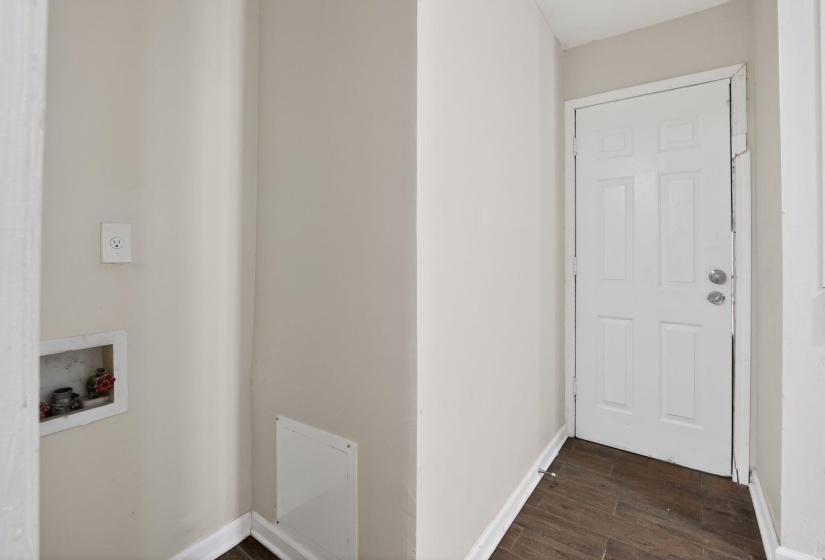 Washroom with washer hookup and wood finish floors