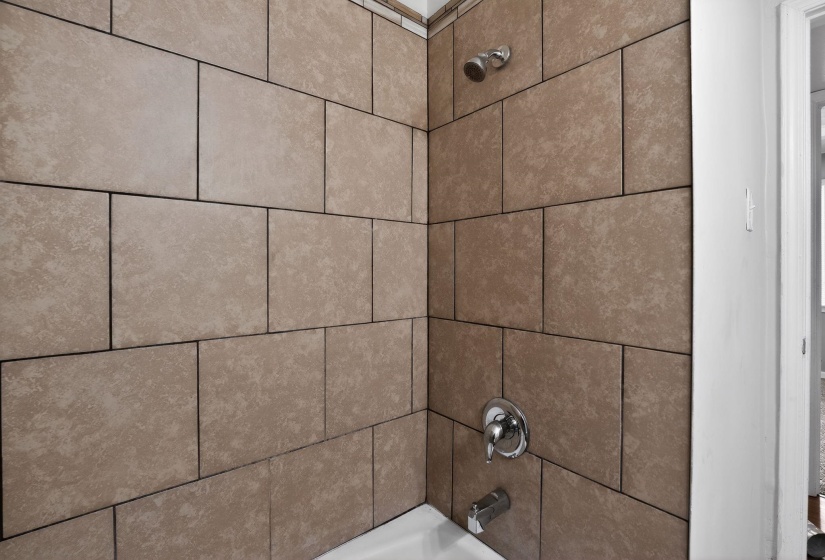 Bathroom view of shower / bathtub combination