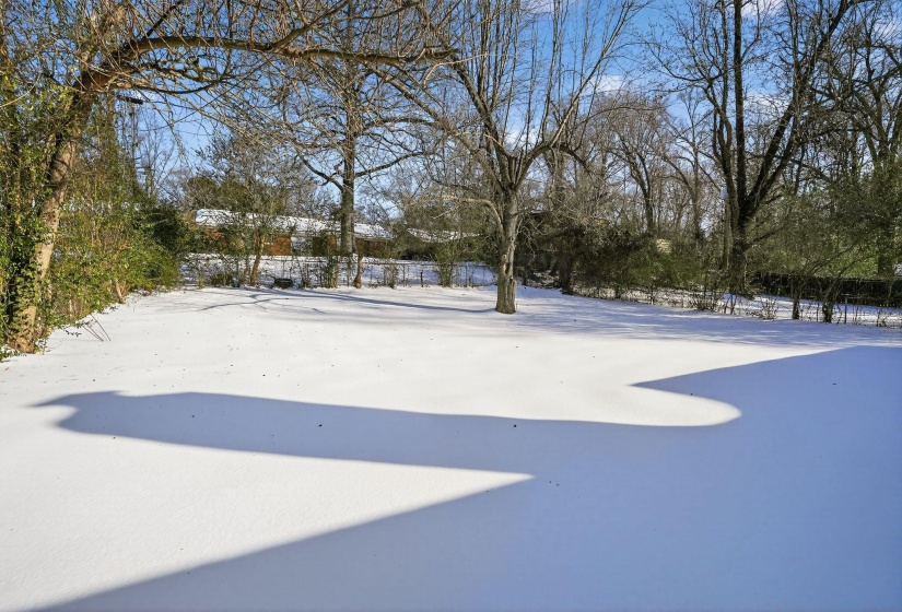 View of yard covered in snow