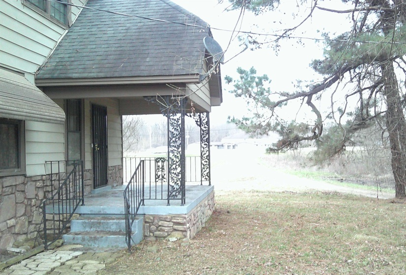 View of yard featuring covered porch