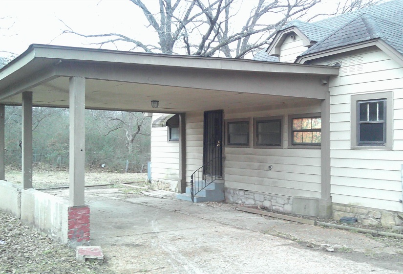View of patio / terrace featuring a carport