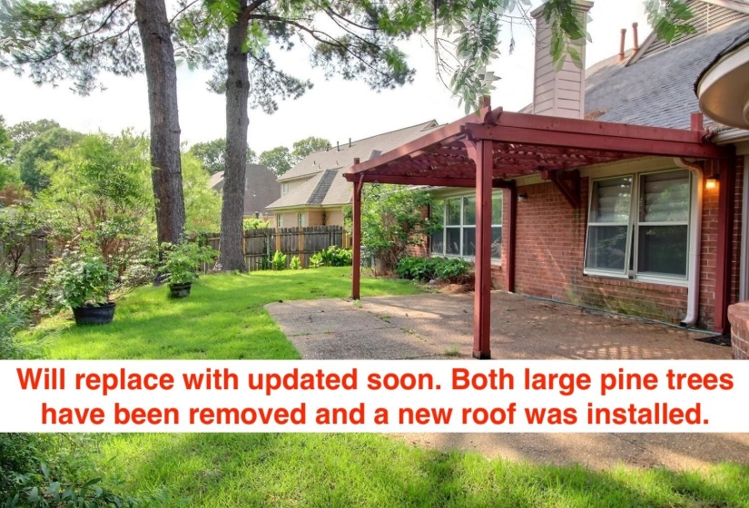 Fenced yard with a patio and a pergola