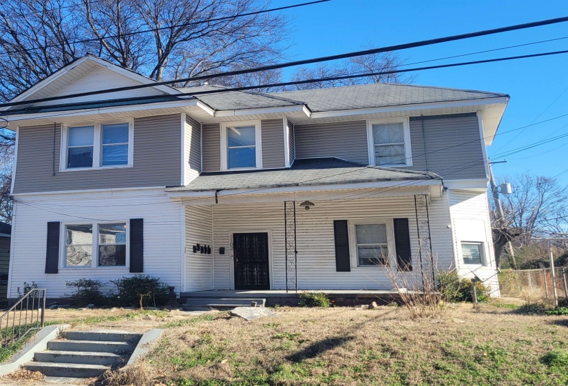 View of front of property featuring a porch and a shingled roof