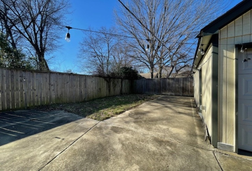 Fenced backyard with a patio area