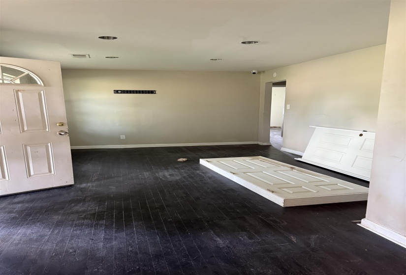 Unfurnished room with hardwood / wood-style flooring and baseboards