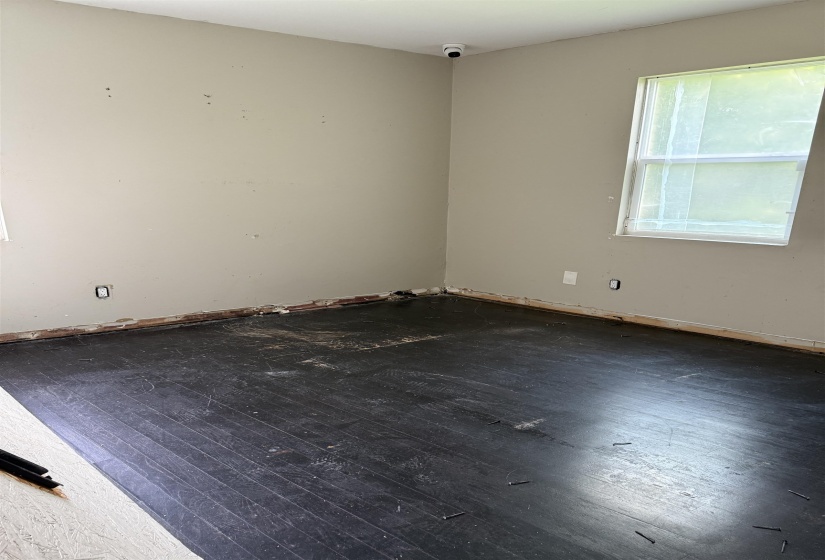 Spare room with hardwood / wood-style flooring