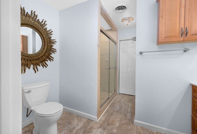 Bathroom featuring vanity and a stall shower