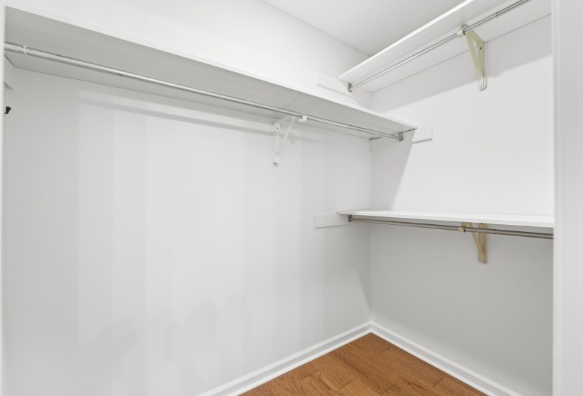 Walk in closet featuring wood finished floors