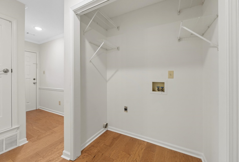Laundry room featuring electric dryer hookup, hookup for a washing machine, light wood finished floors, ornamental molding, and recessed lighting