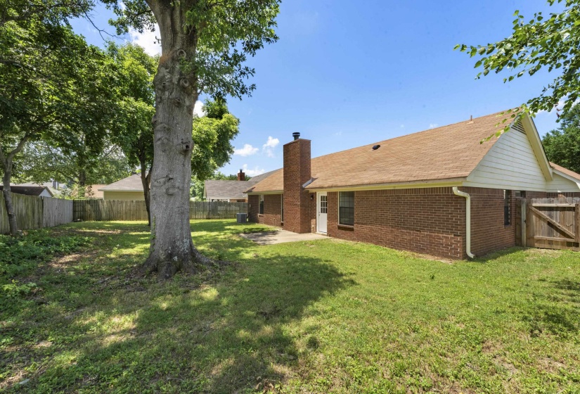 Fenced backyard featuring a patio