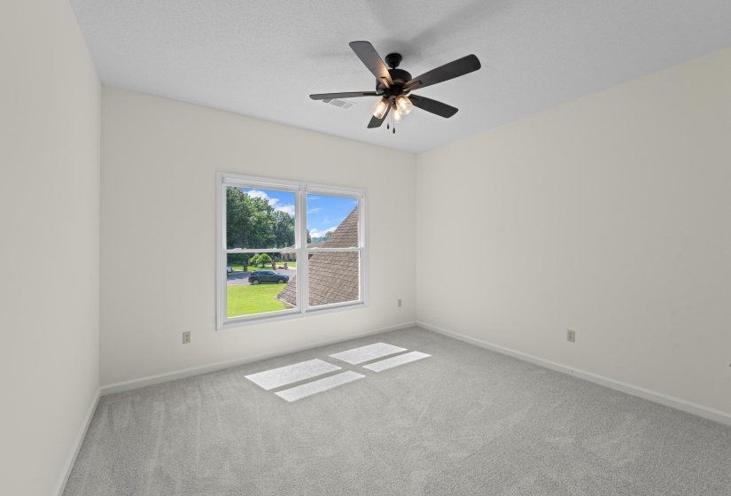 bedroom with carpet and ceiling fan