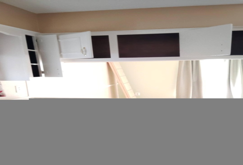 Kitchen featuring white cabinets