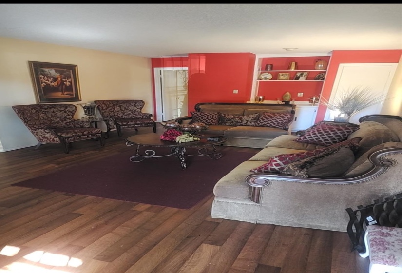 Living area with dark wood finished floors