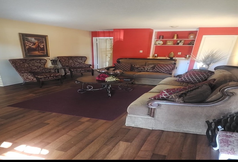 Living area featuring dark wood-style flooring