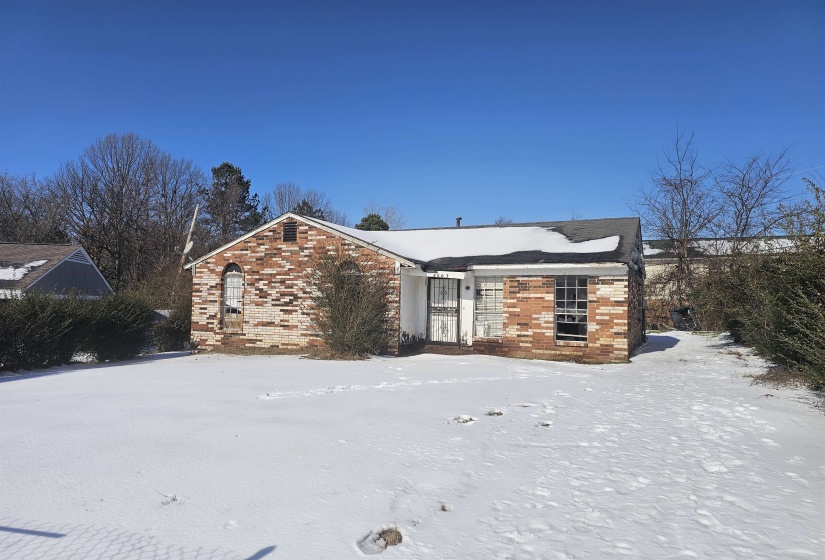 View of front of property featuring brick siding