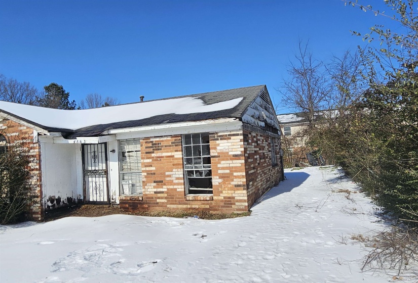 View of front of property with brick siding