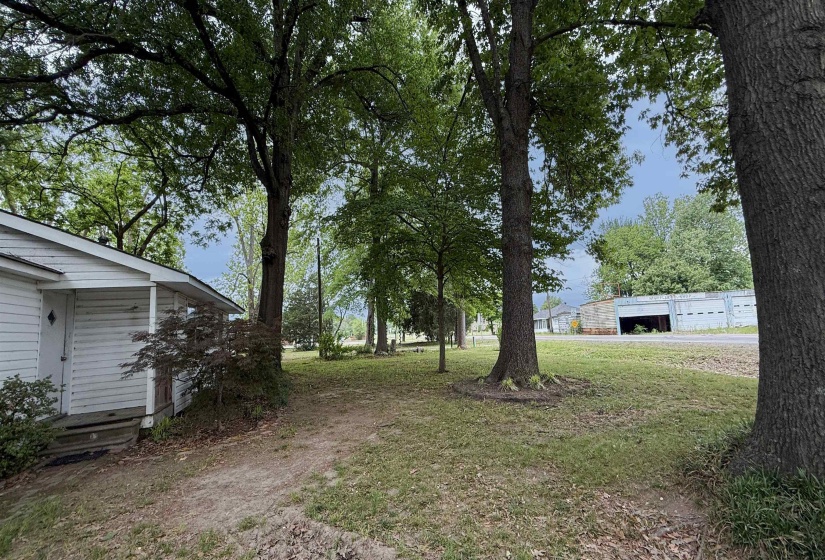 White-sided property with a covered porch