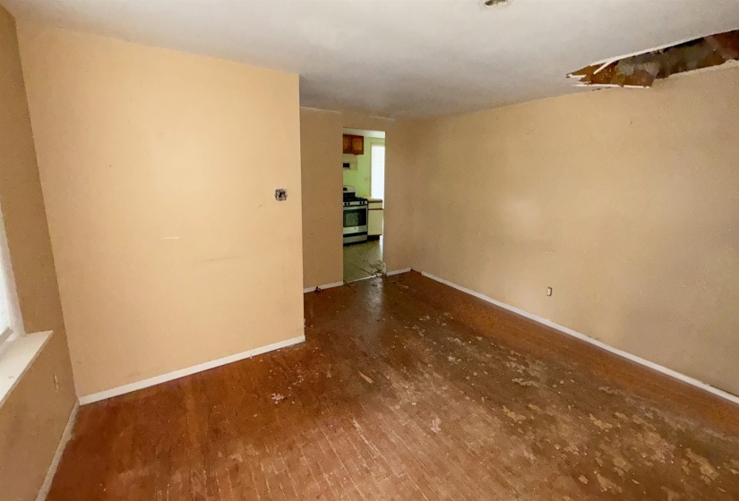 Open floor plan featuring wood-finish flooring