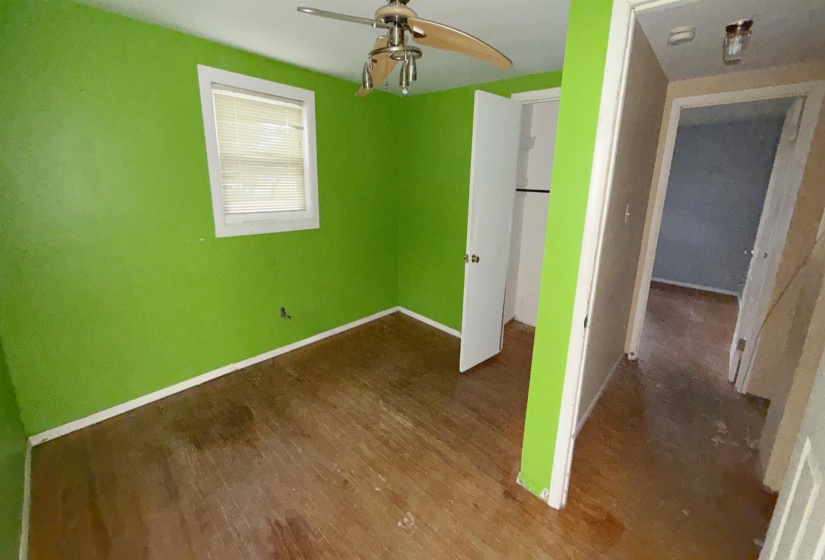 Bedroom featuring wood-finish flooring and a ceiling fan