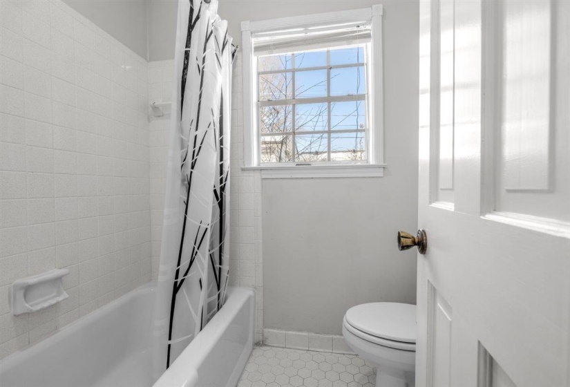 Unfurnished dining area featuring wainscoting, wallpapered walls, a chandelier, and a textured ceiling