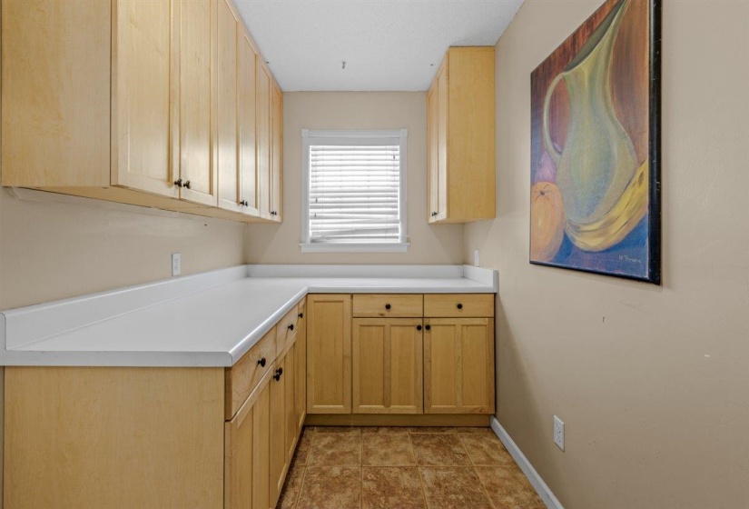 Laundry room featuring baseboards