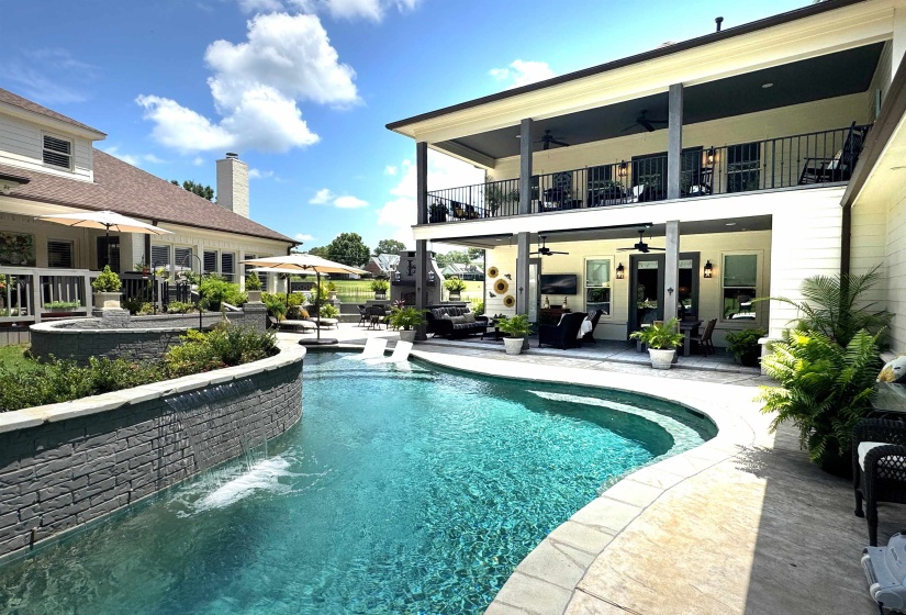 Swimming pool featuring ceiling fan, a patio area, and outdoor lounge area