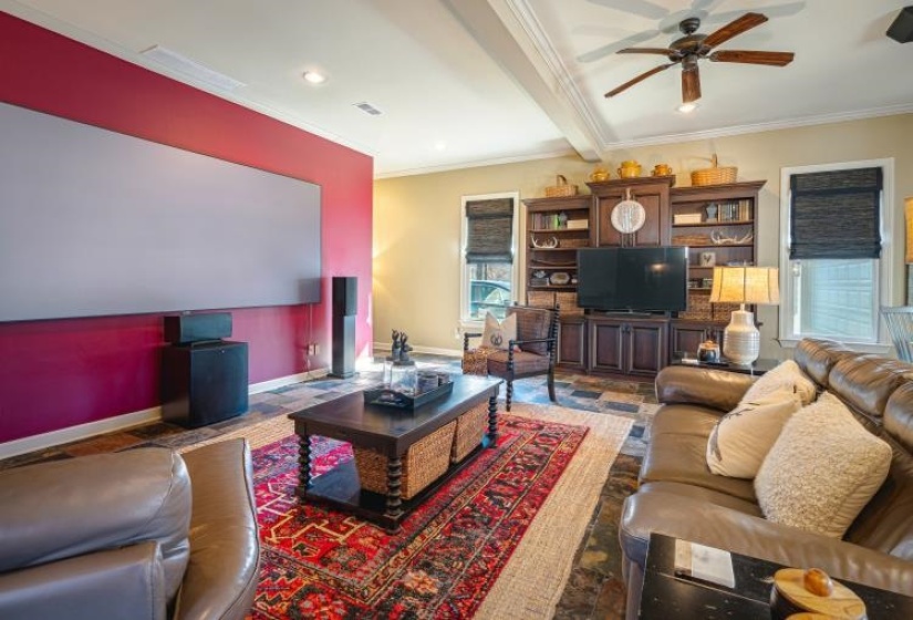 Living area featuring ceiling fan, recessed lighting, visible vents, baseboards, and crown molding
