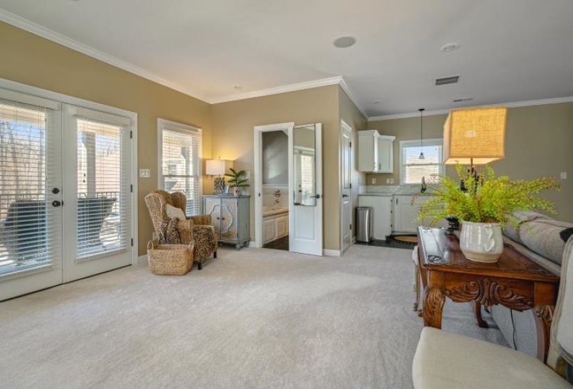 molding, French doors, light colored carpet, and - note small kitchen upstairs & second bath in guest plus walk in closet