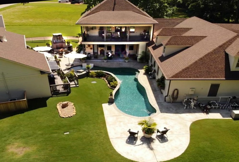 Swimming pool featuring a patio area and a fenced backyard