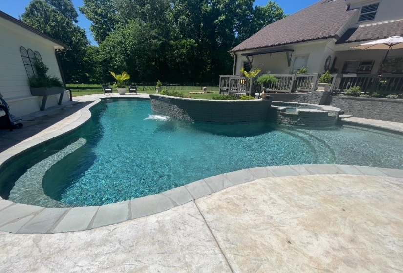 View of swimming pool featuring a pool with connected hot tub