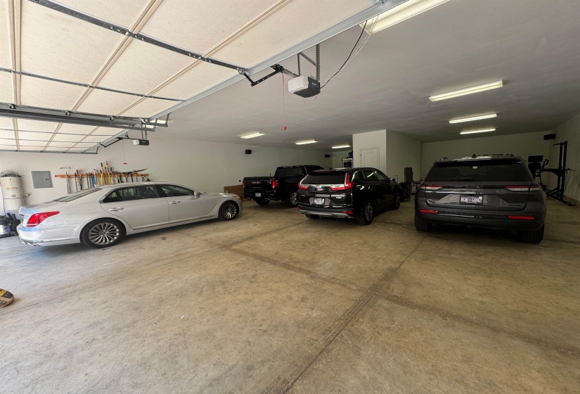 Garage featuring electric panel and 600+ sq. ft floored walk up attic.  huge!!!!  Additional RV covered parking behind garage