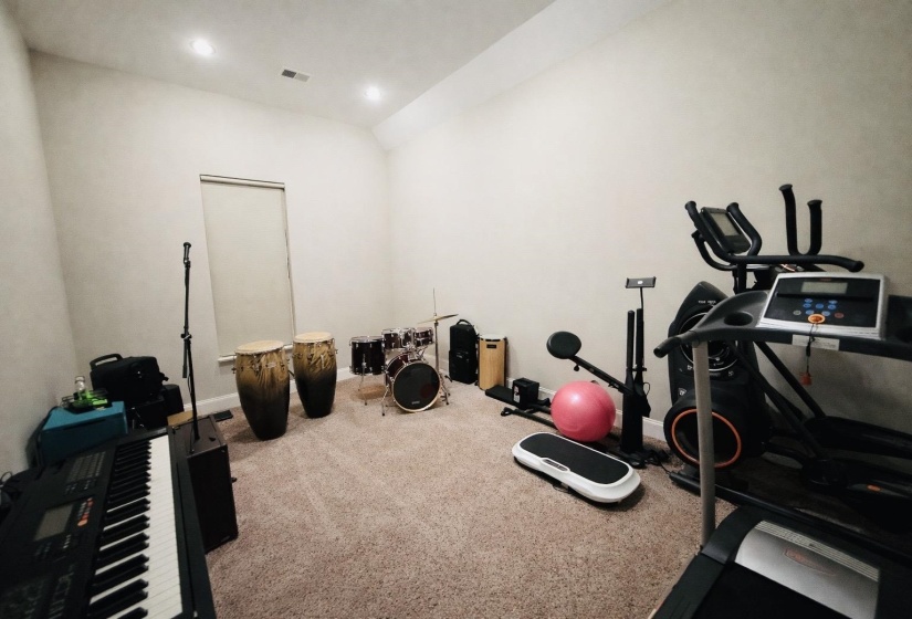 Workout area with carpet floors and recessed lighting