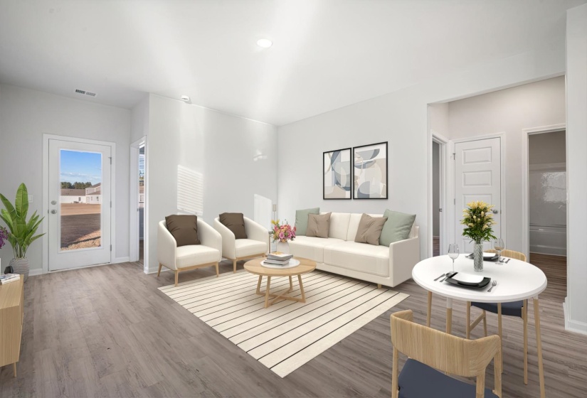 Living area with wood finished floors and recessed lighting