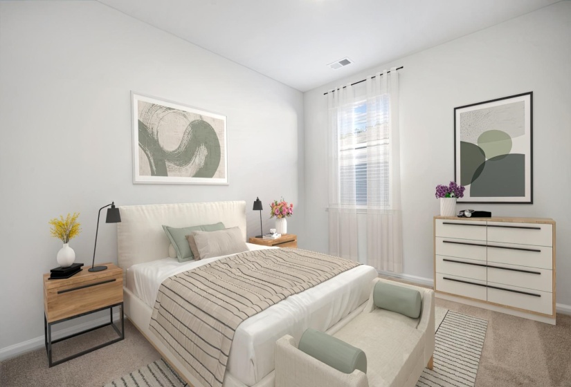 Bedroom featuring carpet floors and baseboards