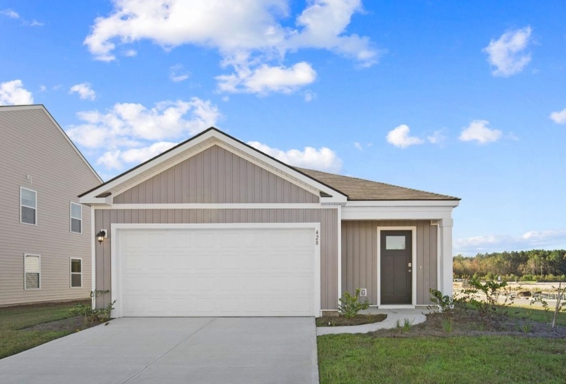 Single story home with concrete driveway, an attached garage, board and batten siding, and a shingled roof