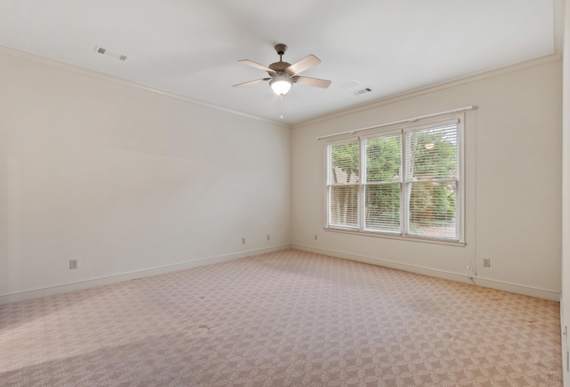 Overlooks double patio area with new fencing, attractive plantings.