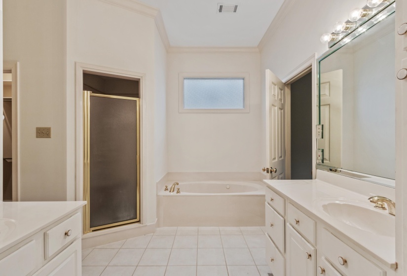 Double vanities, double closets, separate shower and jetted tub.