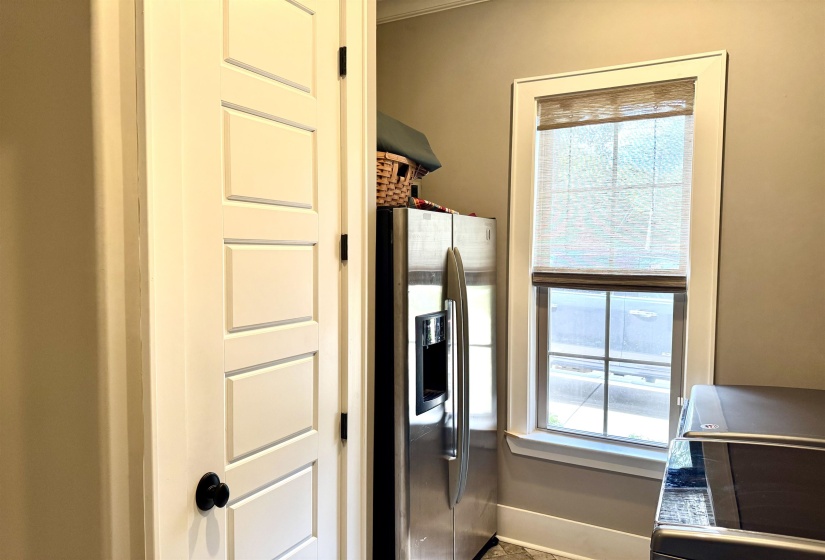 Laundry room closet extra fridge (stays) and washer and dryer Laundry sink and lost of cabinets