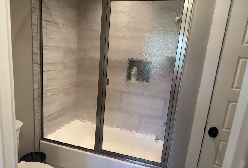 Tub & shower combo with glass door  Jack n Jill between bedroom 3 & 4