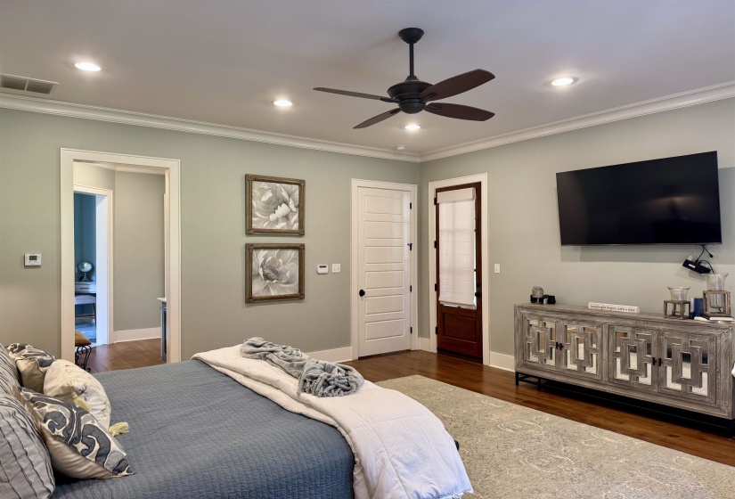 Large 18x20 Master bedroom with sitting area  All nail down hardwood except wet area, tile.  Separate Dressing area, His & hers closets, water closet AND Beverage & Coffee Bar area in between bedroom and Vanity Bath area  Private entrance to patio