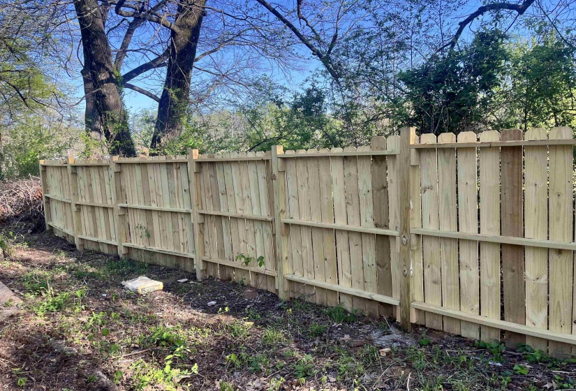 View of yard featuring fence