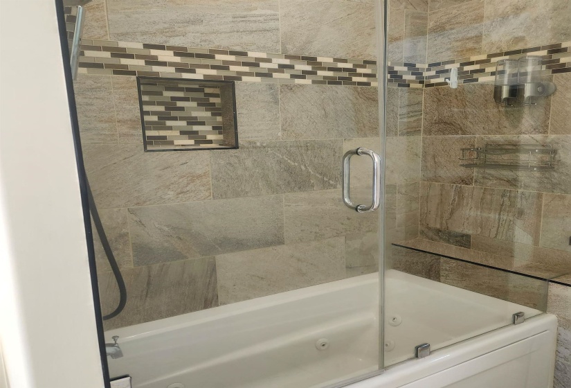 Full bathroom featuring a combined bath / shower with jetted tub