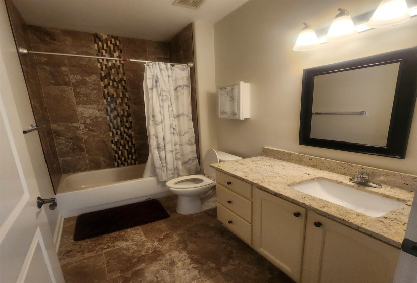Full bathroom featuring vanity and shower / tub combo with curtain