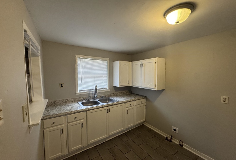Laundry room featuring gas dryer hookup, wood tiled floors, cabinet space, and hookup for an electric dryer
