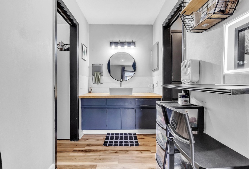 Bathroom featuring wood finished floors and vanity